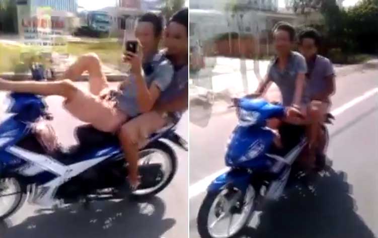 Thanh niên lái xe máy bằng chân, tay chụp ảnh 'tự sướng'